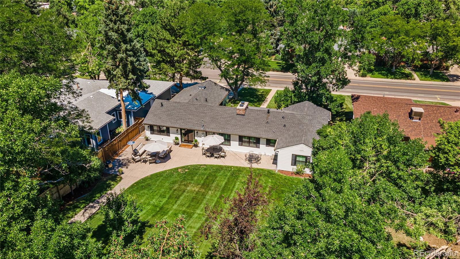 3800 East Dartmouth Avenue Denver, CO 80210 - Photo 45 of 50 an aerial view of a house with yard swimming pool and outdoor seating