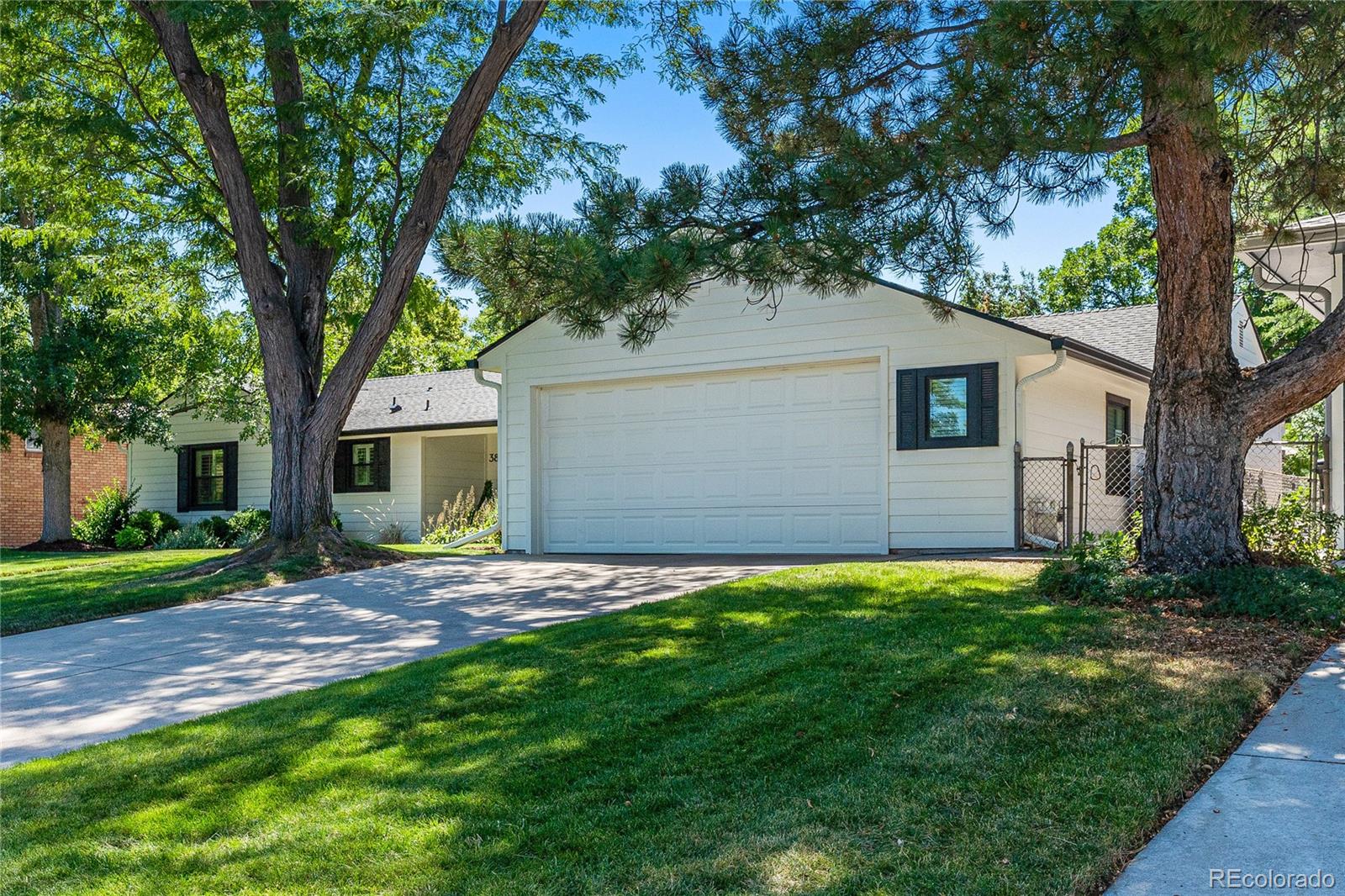 3800 East Dartmouth Avenue Denver, CO 80210 - Photo 48 of 50 a backyard of a house with table and chairs