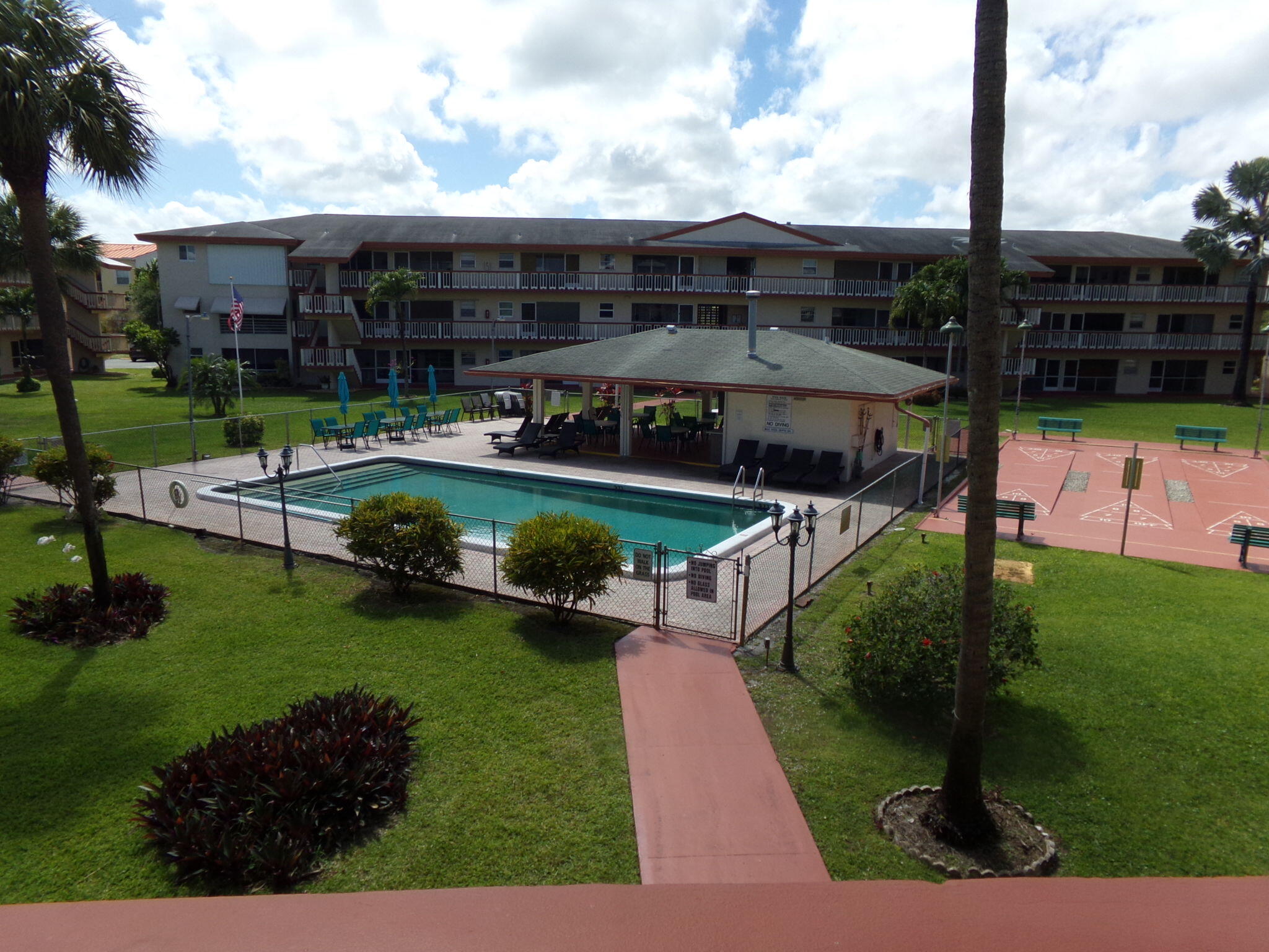 5300 Washington Street, Unit P234 Hollywood, FL 33021 - Photo 1 of 12 a view of a house with garden and patio