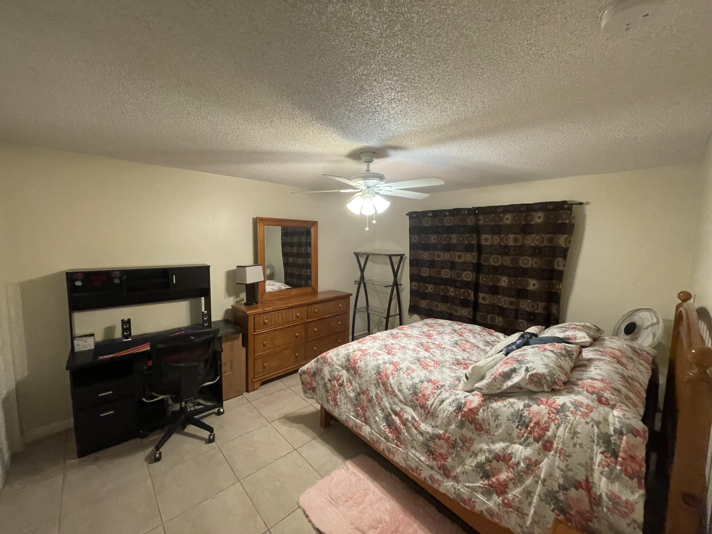 5300 Washington Street, Unit P234 Hollywood, FL 33021 - Photo 11 of 12 a bedroom with a bed and furniture