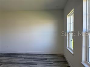 5981 Southwest 154th Place Ocala, FL 34473 - Photo 12 of 18 a view of an empty room with a window