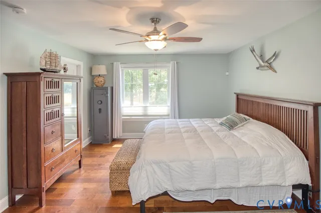 an aerial view of a house with a yard and tree s