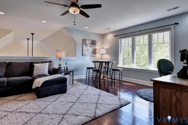 a view of a room with wooden floor