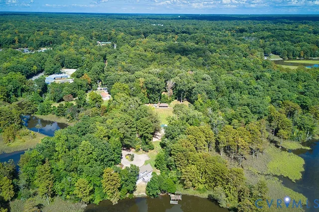 a view of a swimming pool with an outdoor space and seating area