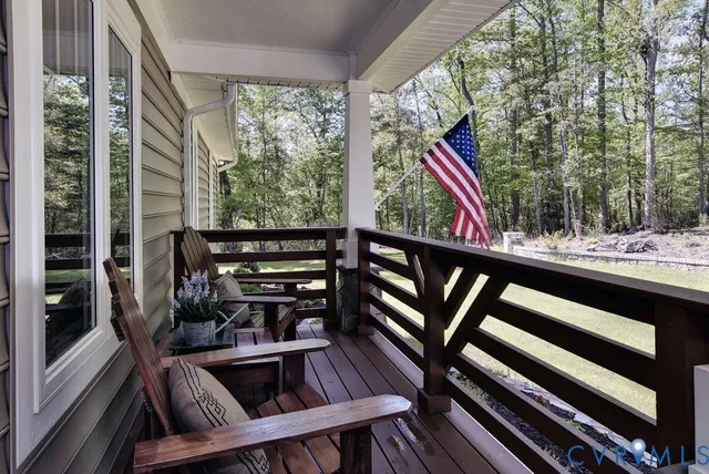 a living room with fireplace furniture and a fireplace