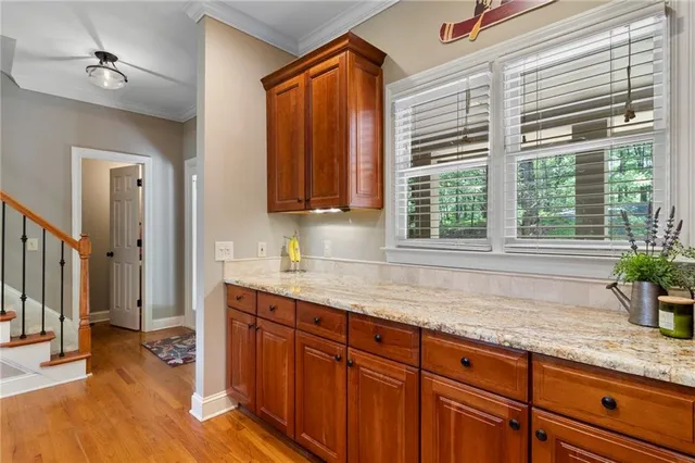a kitchen with stainless steel appliances granite countertop a sink and a granite counter tops
