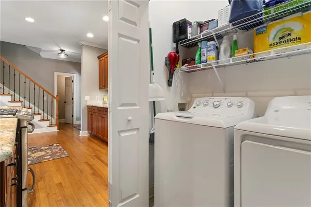 a view of storage and utility room with washer and dryer