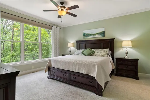 a spacious bedroom with a bed and window