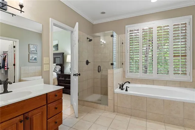 a spacious bathroom with a tub shower and sink