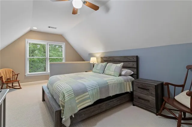 a bathroom with a sink a toilet and a window