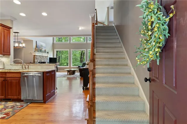 a view of a kitchen with furniture and staircase
