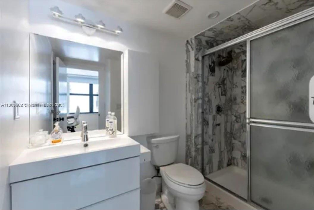 9801 Collins Avenue, Unit 10T Bal Harbour, FL 33154 - Photo 13 of 20 a bathroom with a sink toilet and shower