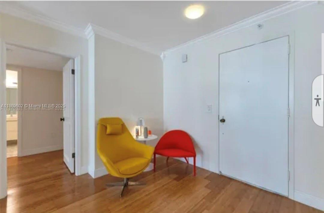 9801 Collins Avenue, Unit 10T Bal Harbour, FL 33154 - Photo 4 of 20 a view of a room with wooden floor and furniture