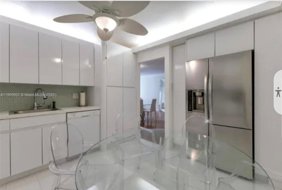 9801 Collins Avenue, Unit 10T Bal Harbour, FL 33154 - Photo 6 of 20 a kitchen with a refrigerator and a sink