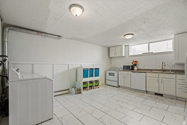149 West 1600th Street South Mapleton, UT 84664 - Photo 31 of 44 Kitchen with washer / clothes dryer, white appliances, dark countertops, a textured ceiling, and light marble finish floors