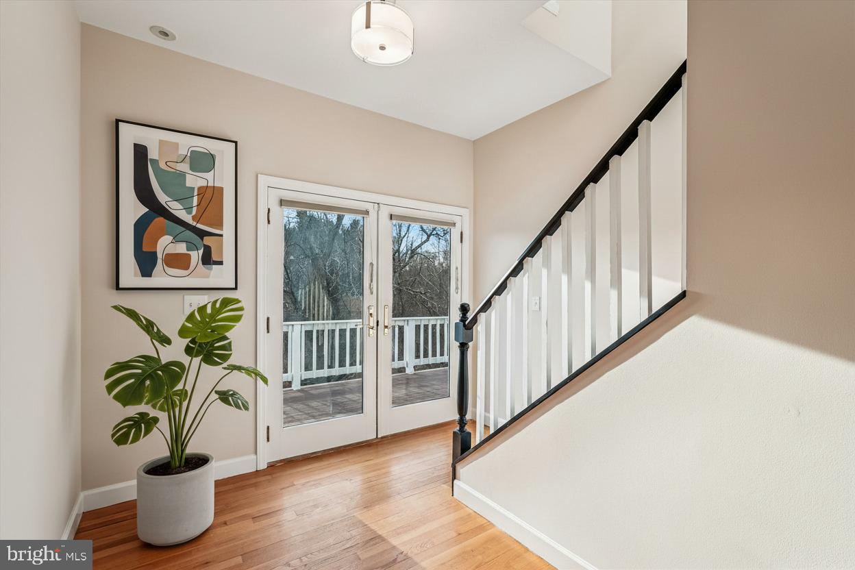 20919 Watermill Road Purcellville, VA 20132 - Photo 39 of 88 Virtually Staged Hallway w/HW Floors, French Doors