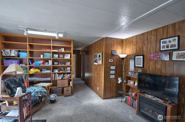 a room with lots of furniture and a flat screen tv