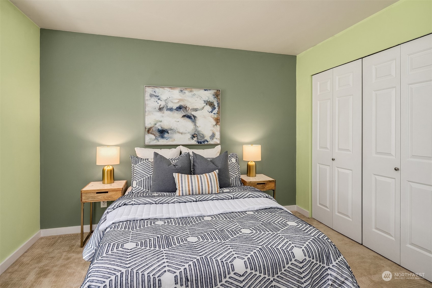 18930 Bothell Everett Highway, Unit D302 Bothell, WA 98012 - Photo 16 of 25 a bedroom with a bed and a night stand