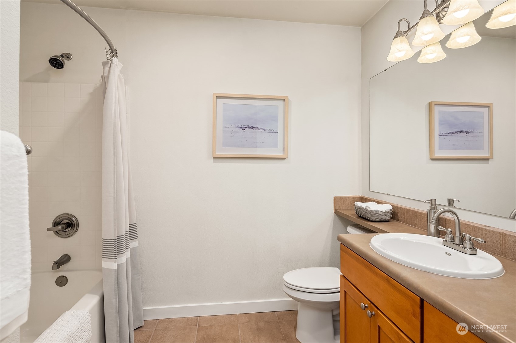 18930 Bothell Everett Highway, Unit D302 Bothell, WA 98012 - Photo 17 of 25 a bathroom with a sink a toilet and shower