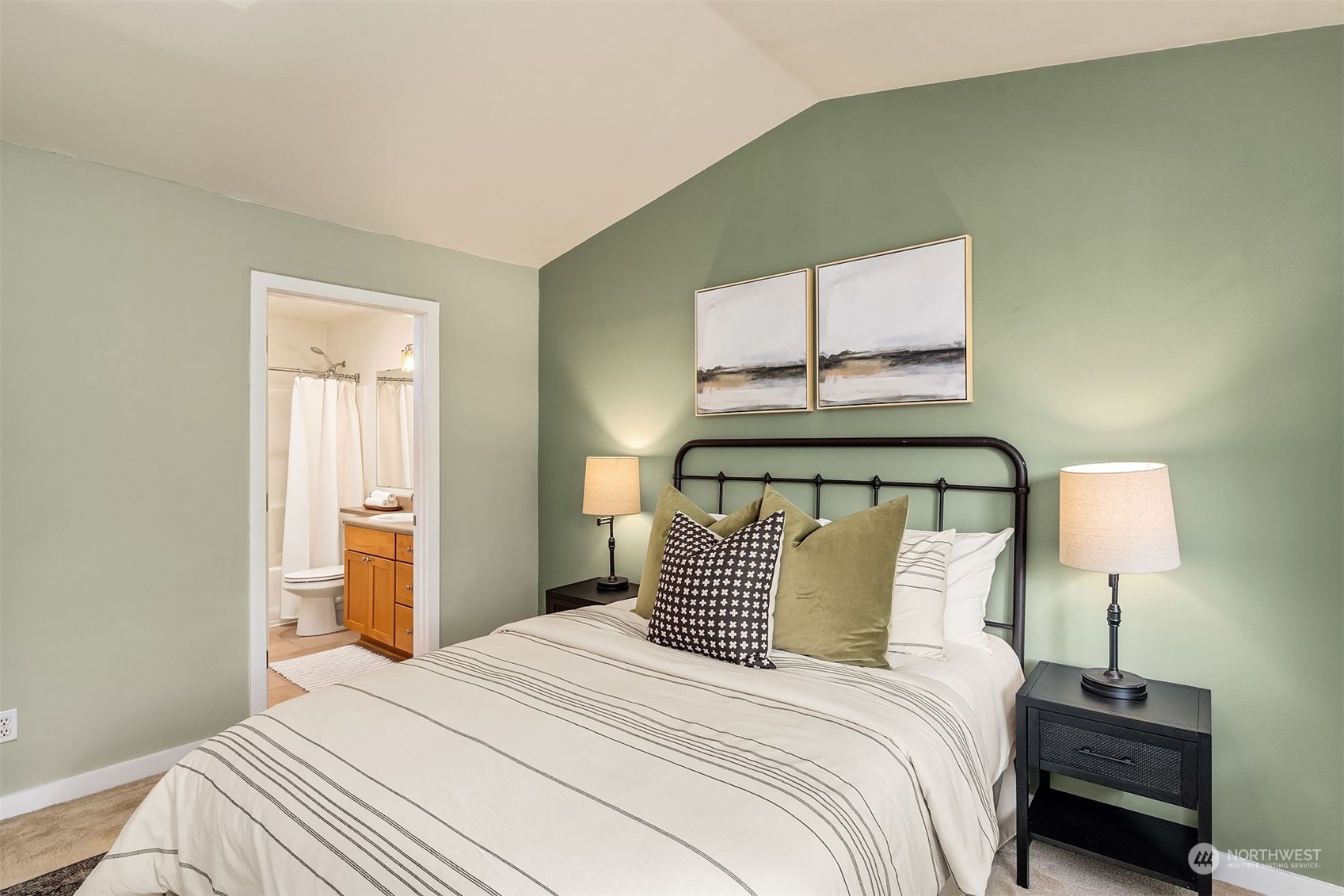 18930 Bothell Everett Highway, Unit D302 Bothell, WA 98012 - Photo 19 of 25 a bedroom with a bed and a lamp