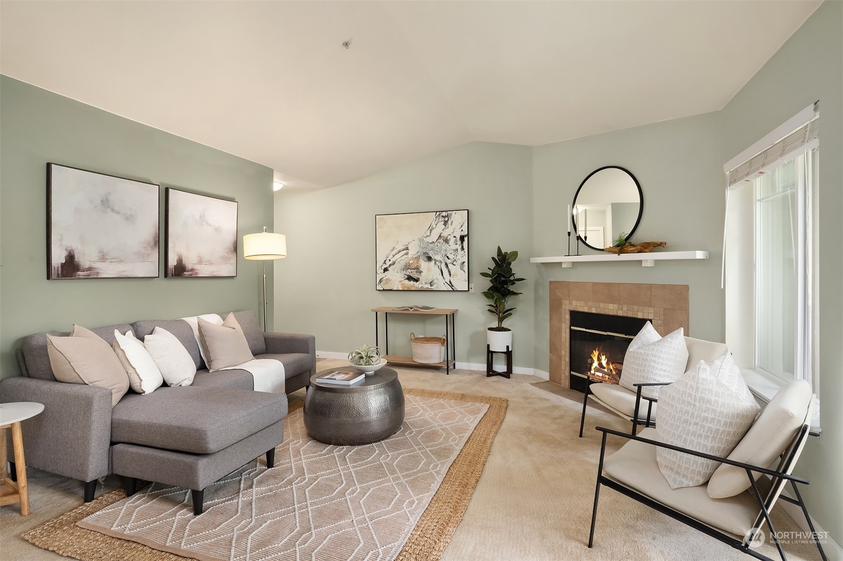 18930 Bothell Everett Highway, Unit D302 Bothell, WA 98012 - Photo 5 of 25 a living room with furniture and a fireplace