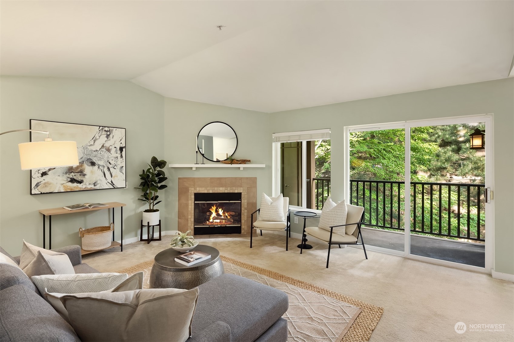 18930 Bothell Everett Highway, Unit D302 Bothell, WA 98012 - Photo 6 of 25 a living room with furniture and a fireplace