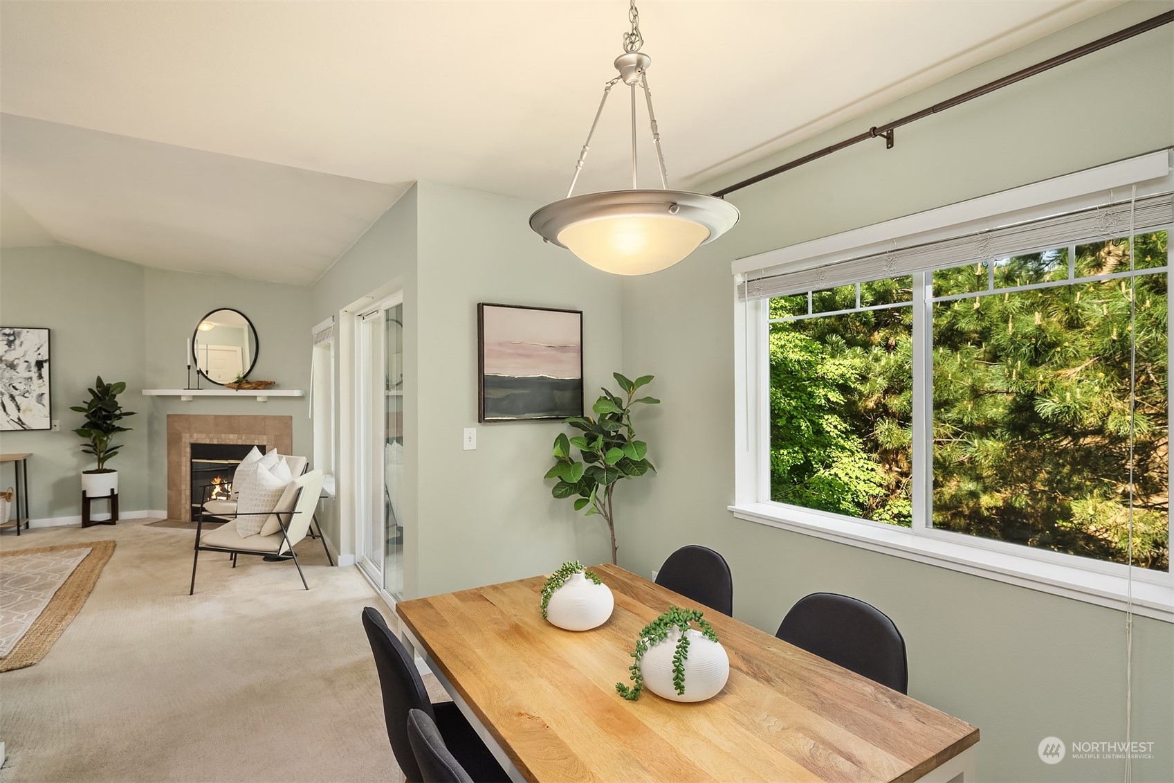 18930 Bothell Everett Highway, Unit D302 Bothell, WA 98012 - Photo 10 of 25 a view of a dining room with furniture a chandelier and wooden floor