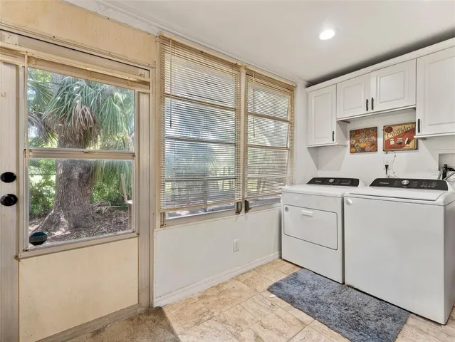 a kitchen with a stove a sink and a granite counter top