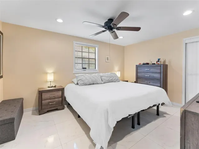 a bedroom with a bed and window