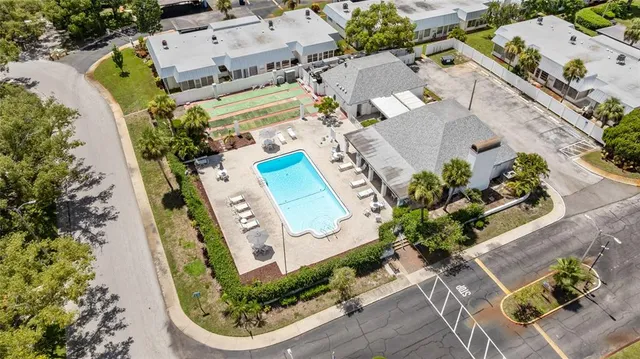 an aerial view of a house with a swimming pool