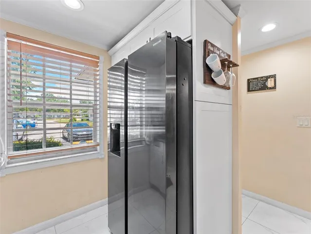 a kitchen with a refrigerator and countertop