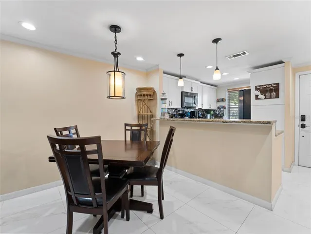 a view of a dining room with furniture