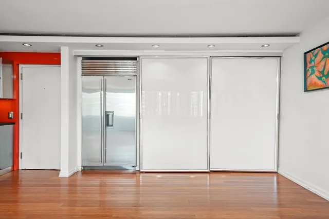 a view of a living room and wooden floor