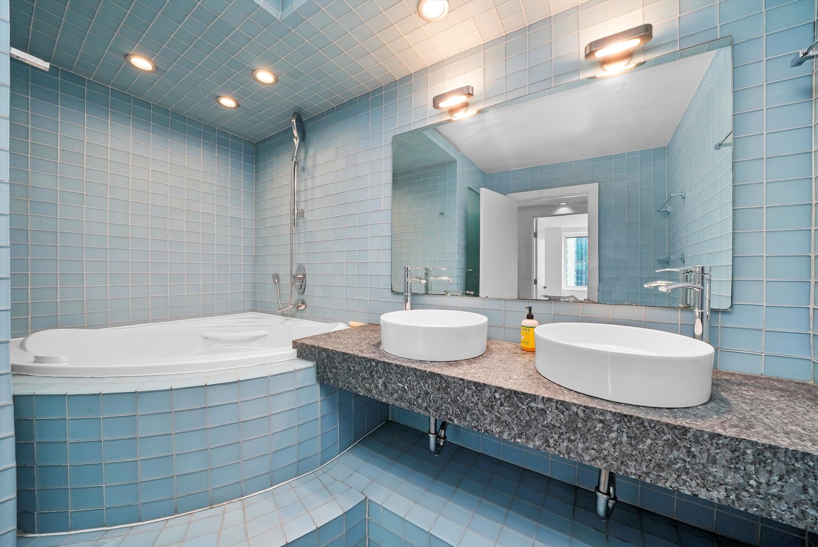 211 East Ohio Street, Unit 2707 Chicago, IL 60611 - Photo 19 of 45 a bathroom with a double vanity sink and a mirror