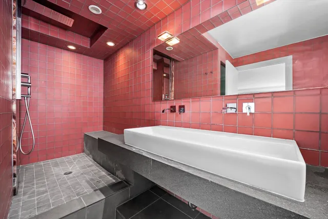 a view of walk in closet with wooden floor