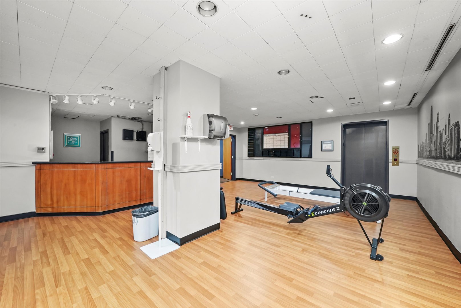 211 East Ohio Street, Unit 2707 Chicago, IL 60611 - Photo 31 of 45 a living room with kitchen appliances and a wooden floor