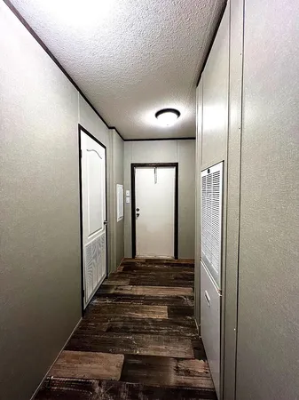 a black car parked in front of house