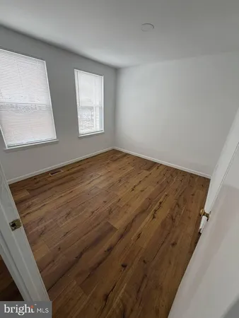 a view of empty room with windows
