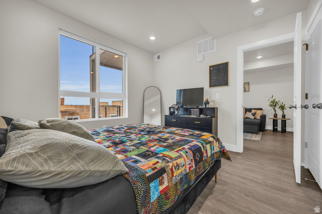 2101 North Main Street, Unit 409 Sunset, UT 84015 - Photo 15 of 18 Bedroom with wood finished floors and recessed lighting