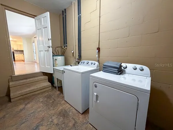 a utility room with dryer and washer
