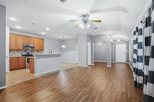 a view of kitchen with sink and wooden floor
