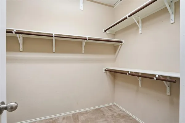 a view of an empty walk in closet