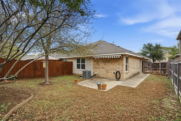 a house with trees in the background
