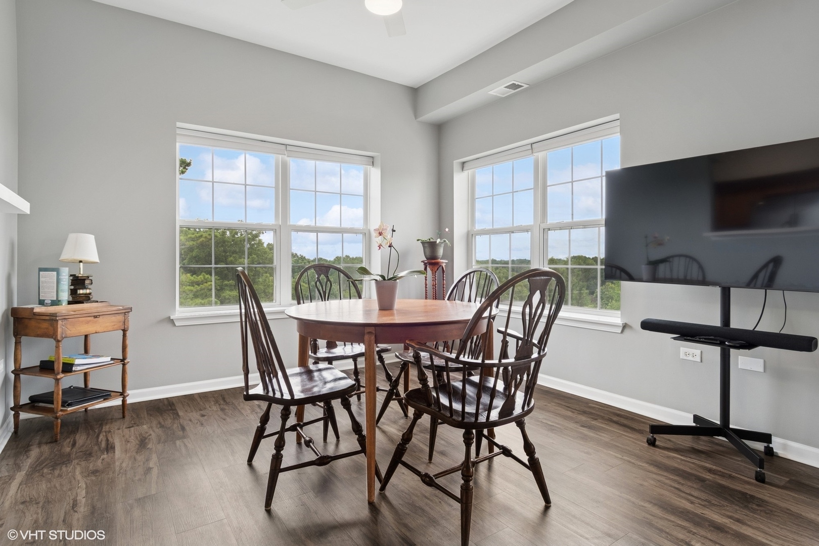 -s099 Lee Court, Unit 401 Winfield, IL 60190 - Photo 5 of 19 a view of a dining room with furniture window and wooden floor