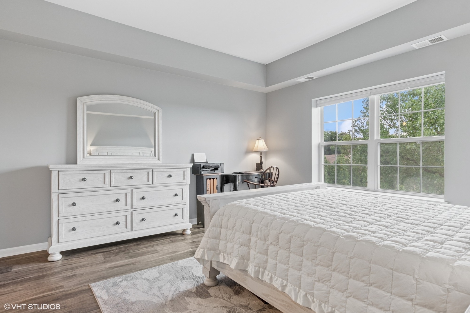 -s099 Lee Court, Unit 401 Winfield, IL 60190 - Photo 10 of 19 a bedroom with a bed and a dresser