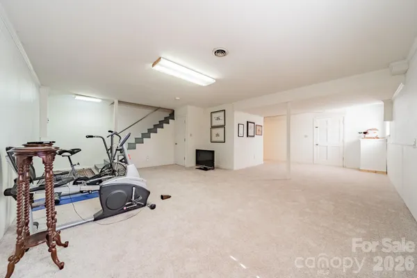 a view of a livingroom with furniture and a projector