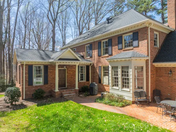 a front view of a house with a yard and porch