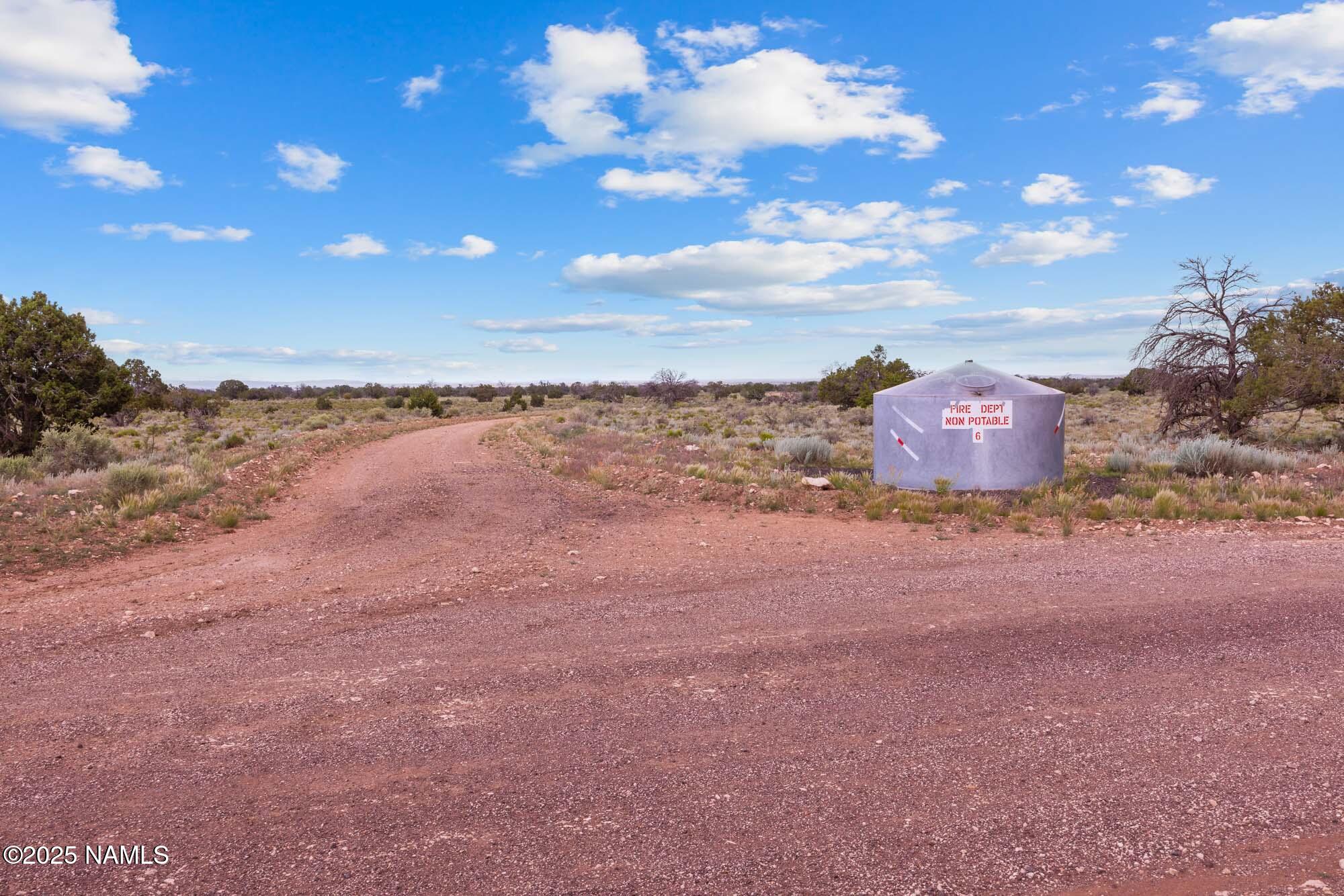4532 East Indian Meadows Road Williams, AZ 86046 - Photo 32 of 37 a view of a house with a yard