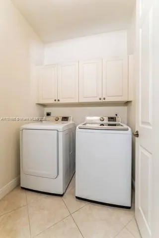 a utility room with washer and dryer
