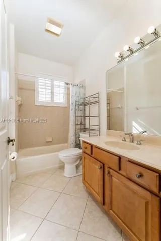 a bathroom with a sink a toilet and bathtub